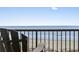 Unwind on the balcony, where comfortable seating offers a peaceful ocean view at 5308 N Ocean Blvd. # 1003, Myrtle Beach, SC 29577