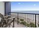 Oceanfront balcony featuring two chairs with a view of the beach and ocean at 5308 N Ocean Blvd. # 1003, Myrtle Beach, SC 29577
