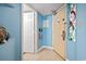 Bright entryway with blue walls, decorative nautical touches, and tiled flooring at 5308 N Ocean Blvd. # 1003, Myrtle Beach, SC 29577