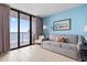Bright living room with tile floors, comfortable seating, and ocean view at 5308 N Ocean Blvd. # 1003, Myrtle Beach, SC 29577