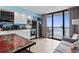 Well-lit kitchen and living space with balcony access and ocean views at 5308 N Ocean Blvd. # 1003, Myrtle Beach, SC 29577