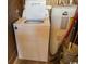 Laundry area featuring a white washing machine and water heater, ready for immediate use at 538 Oatland Rd., Georgetown, SC 29440