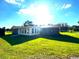 A well-maintained backyard with lush green grass surrounding the property at 538 Oatland Rd., Georgetown, SC 29440