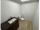Small bathroom featuring vanity with dark countertop and modern sink, plus efficient toilet at 538 Oatland Rd., Georgetown, SC 29440