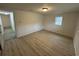 Bedroom features a wood look floor and one window for natural light at 538 Oatland Rd., Georgetown, SC 29440