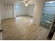 Bedroom with fan, hardwood flooring, closet, and connecting bathroom at 538 Oatland Rd., Georgetown, SC 29440