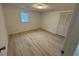 Bedroom features a wood look floor, window, and closet at 538 Oatland Rd., Georgetown, SC 29440