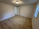 Bedroom with wood-look flooring, neutral walls, and a window at 538 Oatland Rd., Georgetown, SC 29440