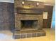 Living room featuring a large brick fireplace with decorative mantle and tile hearth at 538 Oatland Rd., Georgetown, SC 29440