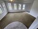 Bright living room featuring large windows for natural light and an interesting patterned carpet at 538 Oatland Rd., Georgetown, SC 29440