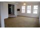 Spacious living room filled with light from big windows and features an interesting brick accent at 538 Oatland Rd., Georgetown, SC 29440