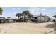 A volleyball net sits on a sandy beach near a covered outdoor bar and restaurant area at 5905 S Kings Hwy. # 810-C, Myrtle Beach, SC 29575