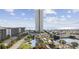 Scenic exterior view with a pond and lush landscaping near a high-rise condo and RV parking at 5905 S Kings Hwy. # 810-C, Myrtle Beach, SC 29575