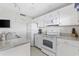 Well-lit kitchen features white cabinets, a breakfast bar, and modern appliances for cooking convenience at 5905 S Kings Hwy. # 810-C, Myrtle Beach, SC 29575