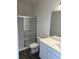 Bright bathroom features a glass-enclosed shower, white vanity, and modern fixtures at 619 Castillo Dr., Loris, SC 29569