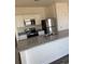 Bright kitchen features granite countertops, stainless appliances, white cabinetry, and an open view of the home at 619 Castillo Dr., Loris, SC 29569