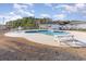 Community pool with picnic tables and an attached restroom and changing facility at 621 Cottontail Trail, Myrtle Beach, SC 29588