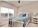Bright bedroom with a white bed, a large window and stylish decor at 622 Lorenzo Dr. # 622, North Myrtle Beach, SC 29582