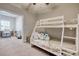 Cozy bedroom featuring a white bunk bed with cute decorative pillows at 622 Lorenzo Dr. # 622, North Myrtle Beach, SC 29582