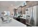 Open kitchen featuring stainless appliances, island with counter seating, and custom cabinets at 622 Lorenzo Dr. # 622, North Myrtle Beach, SC 29582
