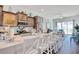 Beautiful kitchen island with marble countertops, seating and open concept living space at 622 Lorenzo Dr. # 622, North Myrtle Beach, SC 29582