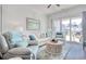 Bright and airy living room with hardwood floors, white furniture and lots of light at 622 Lorenzo Dr. # 622, North Myrtle Beach, SC 29582