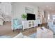 Cozy living room features decorative furniture, entertainment center with a TV, and bright decor at 622 Lorenzo Dr. # 622, North Myrtle Beach, SC 29582