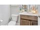 Charming powder room with modern fixtures, decorative mirror, and stylish decor at 622 Lorenzo Dr. # 622, North Myrtle Beach, SC 29582