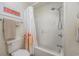 Bathroom featuring a shower and bath combination with white floral pattern shower curtain at 701 1St Ave. S # 32C, North Myrtle Beach, SC 29582