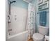 Bathroom features a shower with installed seat and grab bars, a mounted shower head, and seashell-themed decor at 701 1St Ave. S # 32C, North Myrtle Beach, SC 29582