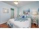 Cozy bedroom showcasing beach-themed decor, and a doorway leading to a bathroom at 701 1St Ave. S # 32C, North Myrtle Beach, SC 29582