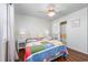 Bedroom with wood floors, a ceiling fan and an ensuite bathroom with shower and bath combination at 701 1St Ave. S # 32C, North Myrtle Beach, SC 29582
