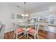 Dining area with glass-top table and seating for four, adjacent to the kitchen at 701 1St Ave. S # 32C, North Myrtle Beach, SC 29582