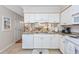 Well-lit kitchen with granite countertops and modern appliances at 701 1St Ave. S # 32C, North Myrtle Beach, SC 29582