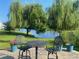 Inviting backyard patio with outdoor seating, offering serene water views at 808 Yauhannah Dr., Little River, SC 29566