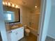 Full bathroom features a vanity with granite countertops, a toilet, and a shower-tub combo with tile flooring at 808 Yauhannah Dr., Little River, SC 29566