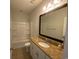 Full bathroom features a vanity with granite countertops, a toilet, and a shower-tub combo at 808 Yauhannah Dr., Little River, SC 29566
