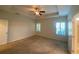 Large bedroom features a ceiling fan and windows with plantation shutters at 808 Yauhannah Dr., Little River, SC 29566