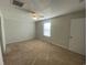Empty bedroom has neutral paint, beige carpet, a ceiling fan, and a window that lets in natural light at 808 Yauhannah Dr., Little River, SC 29566