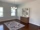 Elegant dining room with hardwood floors, chandelier, and built-in display cabinet at 808 Yauhannah Dr., Little River, SC 29566