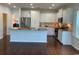Bright kitchen features granite counters, stainless appliances, an island, and white cabinetry at 808 Yauhannah Dr., Little River, SC 29566