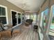Bright sunroom with tile floors and views of the backyard at 808 Yauhannah Dr., Little River, SC 29566