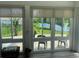 Sunroom featuring serene views of the pond with access to the patio at 808 Yauhannah Dr., Little River, SC 29566