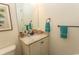 Bathroom with a granite countertop, decorative hand towels, and framed tropical print art at 845 Hall Lane # B, Myrtle Beach, SC 29577