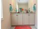 Elegant bathroom with a double vanity, granite countertops, decorative mirror, and neutral wall paint at 845 Hall Lane # B, Myrtle Beach, SC 29577