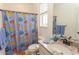 Bathroom with a fish themed shower curtain, and granite countertop sink at 845 Hall Lane # B, Myrtle Beach, SC 29577