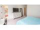 Bedroom showing the queen bed, TV on dresser, bathroom entrance, and view to the outside at 845 Hall Lane # B, Myrtle Beach, SC 29577