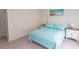 Comfortable bedroom with queen bed, matching bedside tables, carpet flooring, and beach-themed wall art at 845 Hall Lane # B, Myrtle Beach, SC 29577