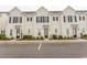 Charming townhome exterior with black shutters, tidy landscaping, and convenient parking in front at 845 Hall Lane # B, Myrtle Beach, SC 29577