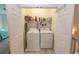 Functional laundry closet with a washer, dryer, and overhead shelving for storage at 845 Hall Lane # B, Myrtle Beach, SC 29577